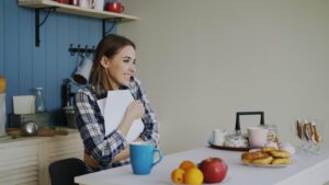 A special needs mom at a kitchen table overwhelmed by paperwork—representing one big beautiful bill special needs families facing Medicaid and IEP changes
