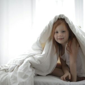 Weighted blanket on a child's bed for sensory support