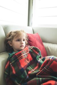 child with weighted blanket sensory swing autism comparison calming tool