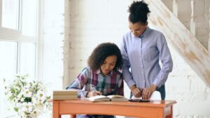 mom helping AuDHD child with autism and ADHD at home