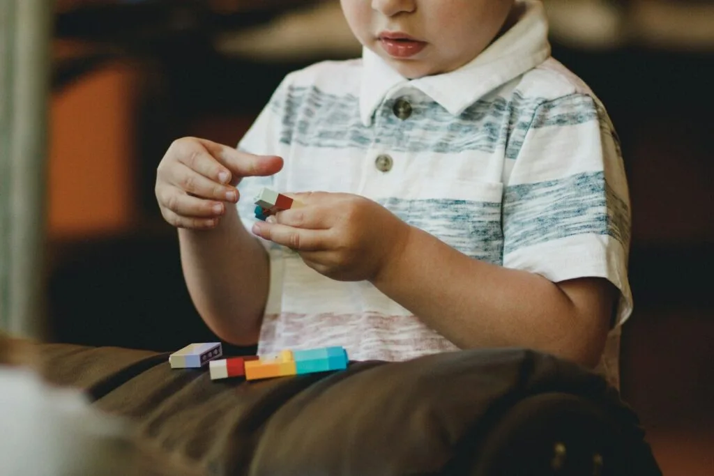 autistic child demonstrating executive function challenges while trying to complete task