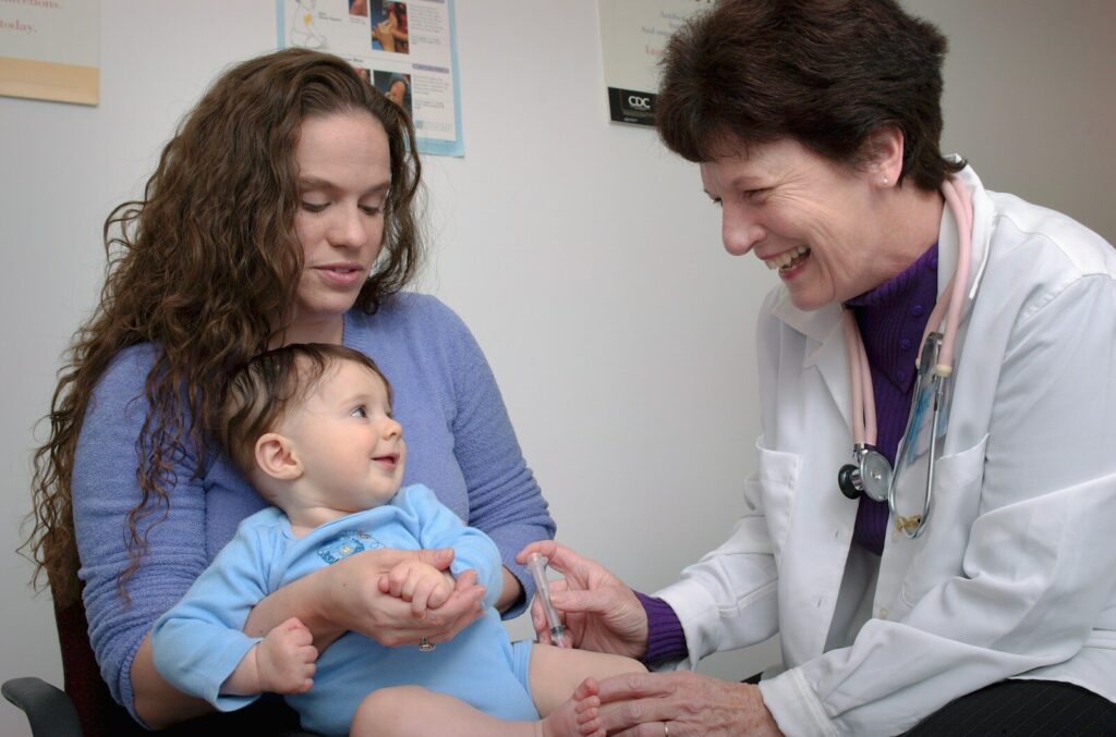 mother with child at healthcare appointment for autism therapy coverage