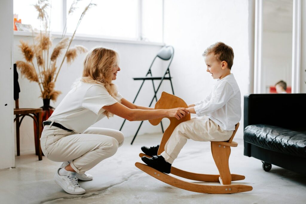 therapist working with autistic child on sensory equipment for autism therapy