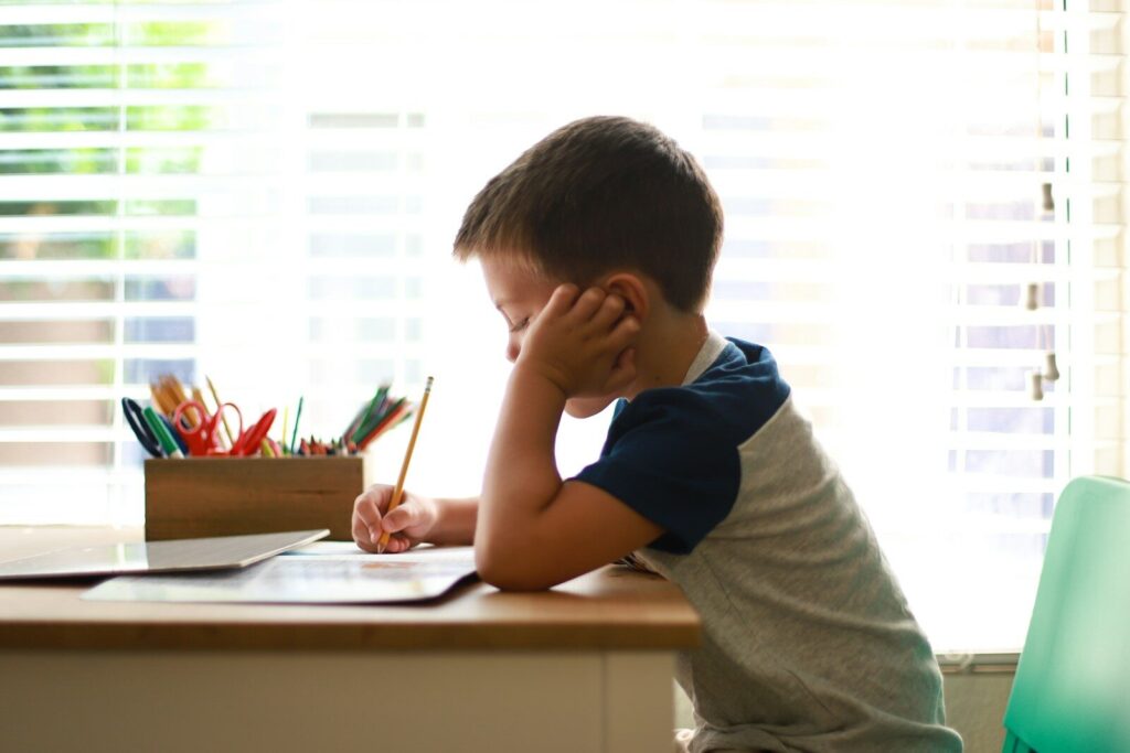 ADHD homework battles - child frustrated at desk