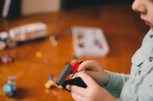 autistic child stimming with sensory toys showing repetitive play behavior