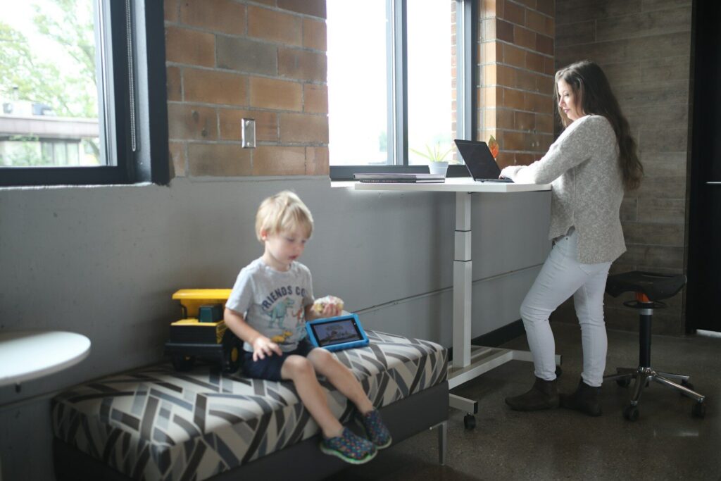 Mom waiting with toddler to find a developmental pediatrician for an autism evaluation
