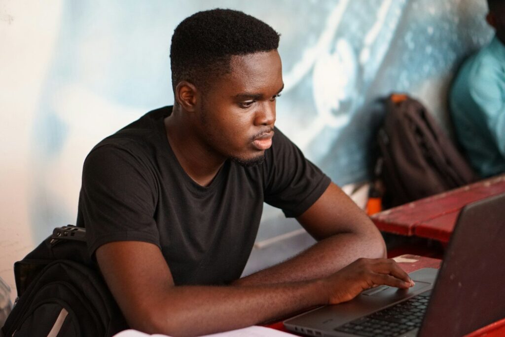 autistic teen preparing for college studying independently at desk