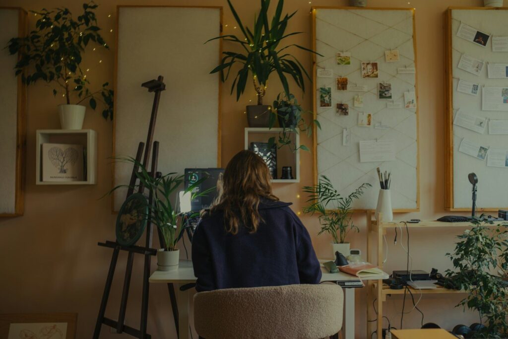 autistic adult woman in cozy home workspace sensory tools setup 2026