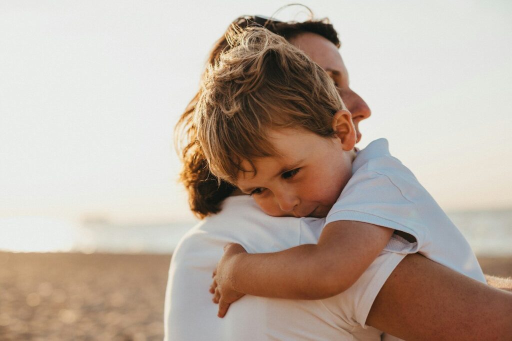 parent and child co-regulation hug to calm autistic child during overwhelm
