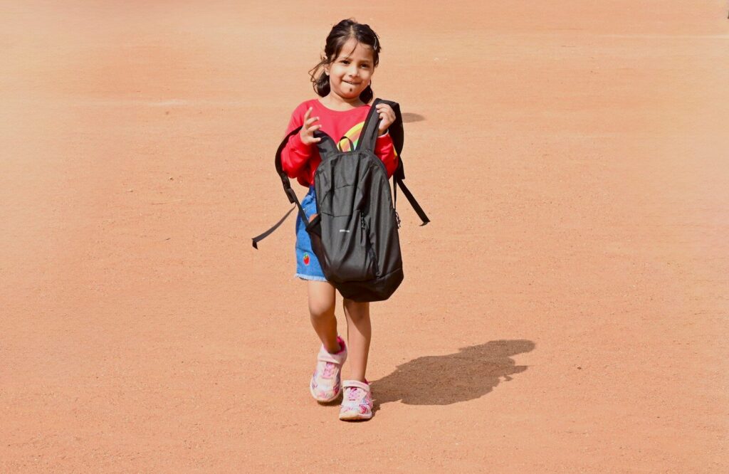 child carrying backpack for proprioceptive activities autism heavy work at home