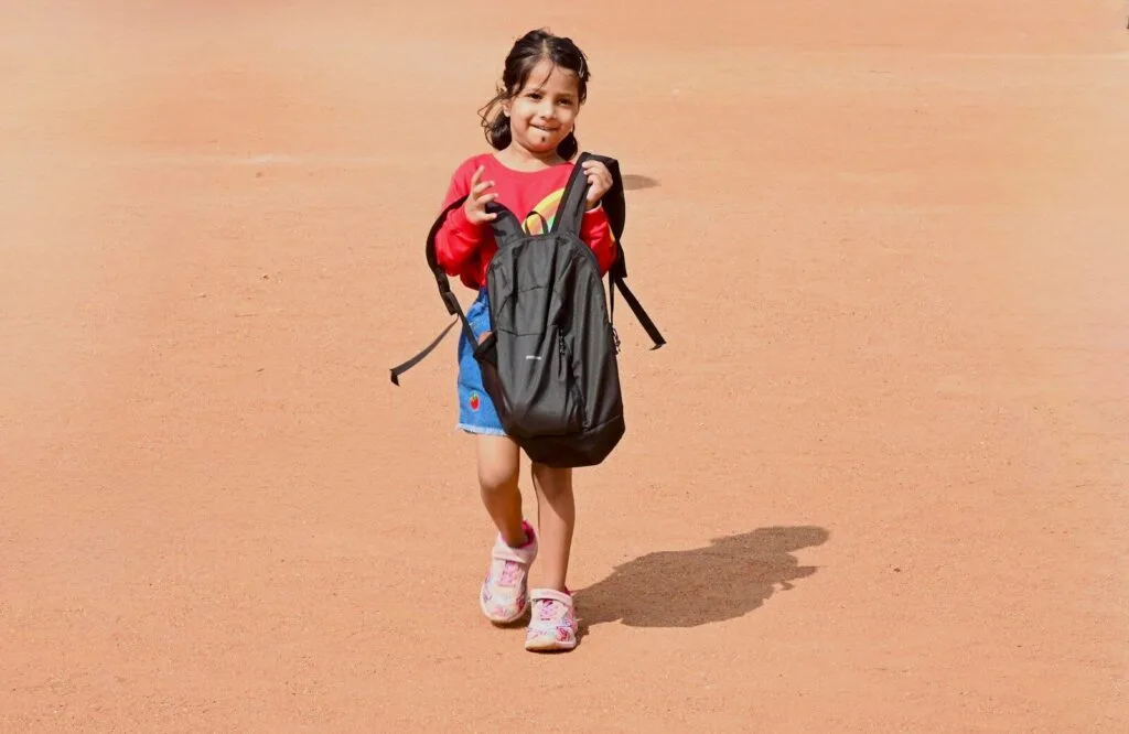 child carrying backpack for proprioceptive activities autism heavy work at home