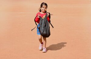 child carrying backpack for proprioceptive activities autism heavy work at home