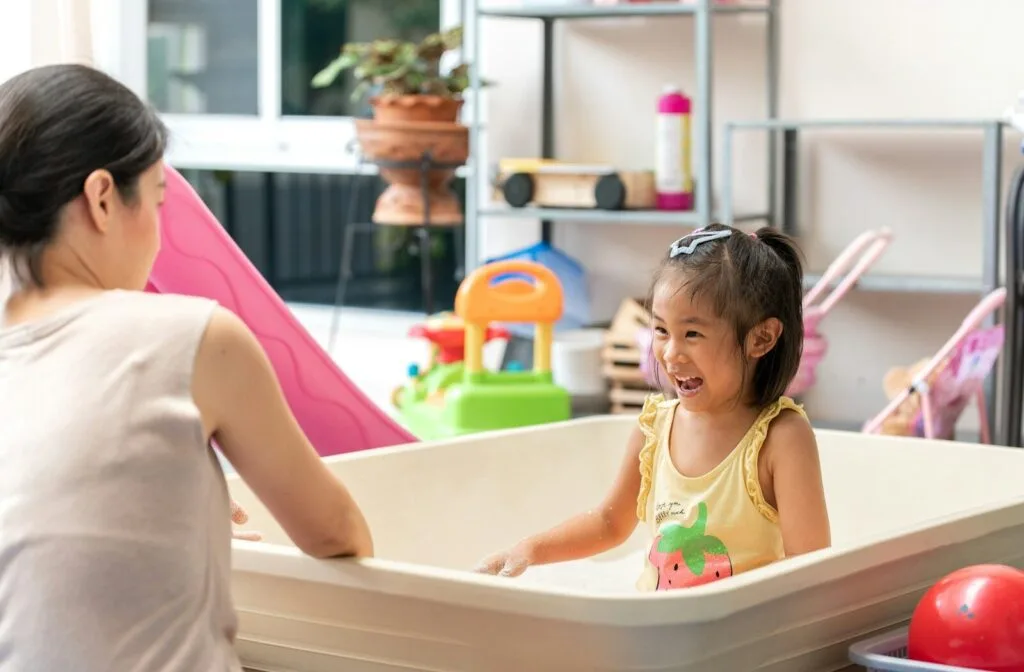 mother helping child with sensory diet activity at home
