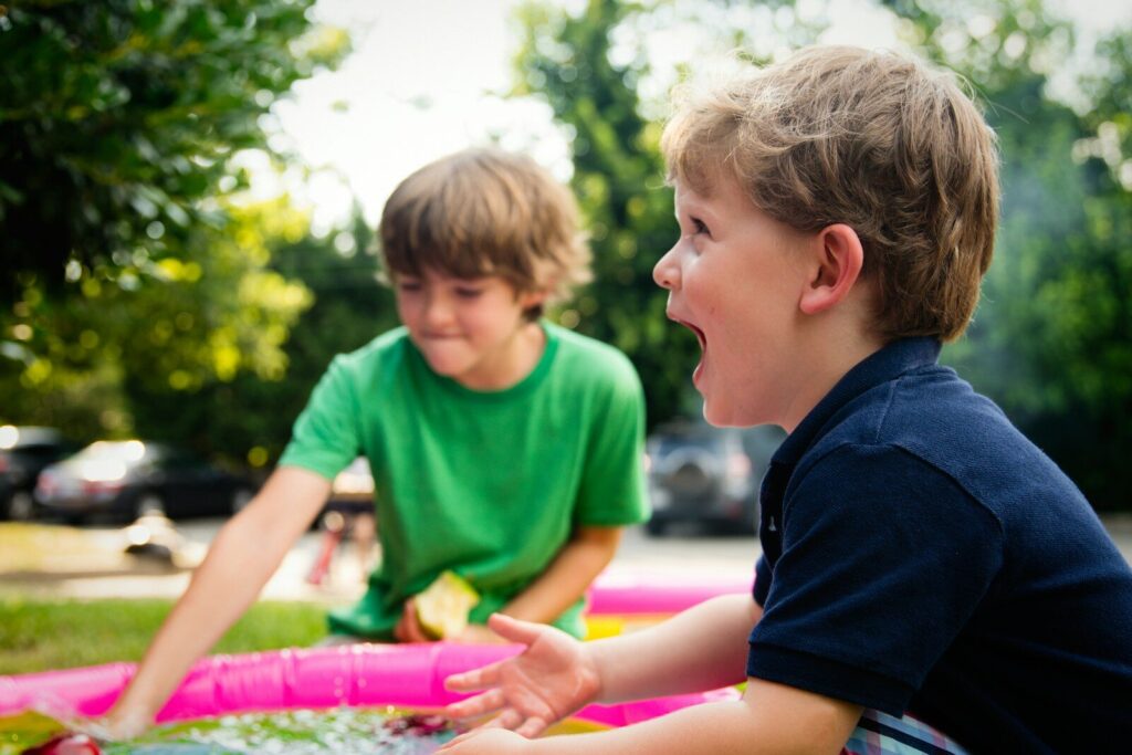 child at special needs summer camp autism programs outdoor activity with instructor