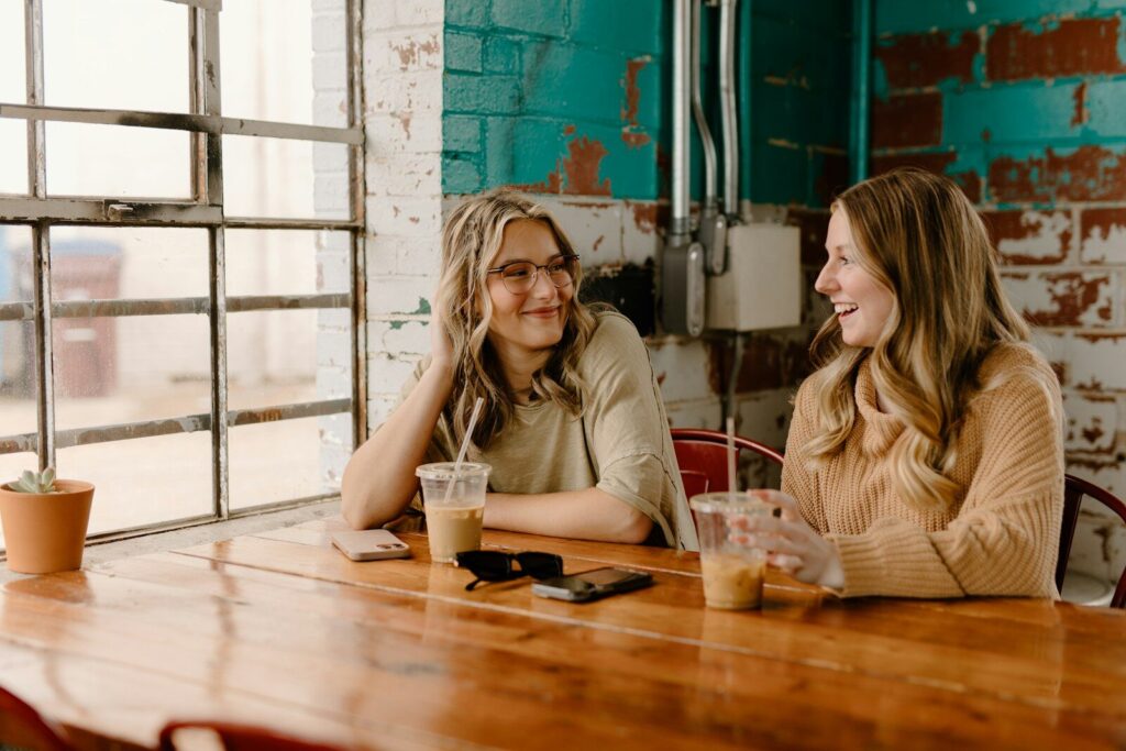 two women friends talking over coffee representing special needs mom friendships and connection