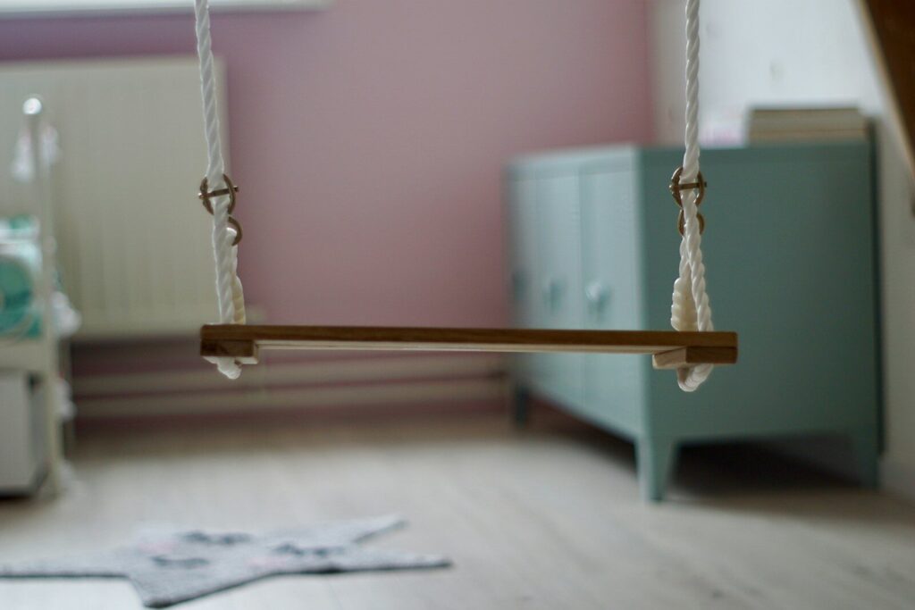 indoor sensory swing hanging from ceiling in child bedroom safe installation