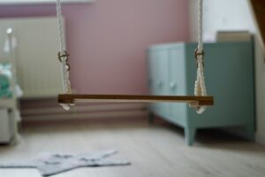 indoor sensory swing hanging from ceiling in child bedroom safe installation