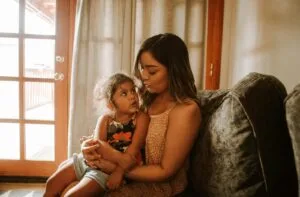 Mother holding child - gestalt language processing autism support